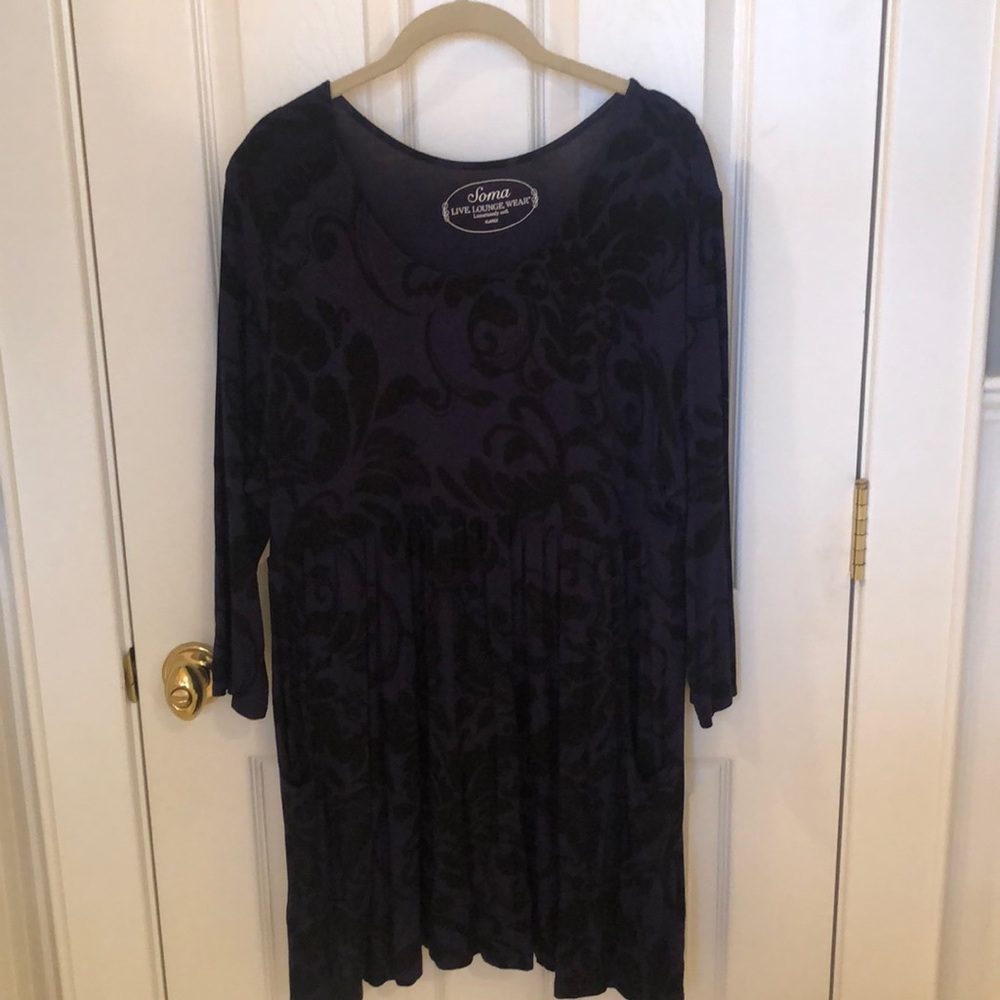 Blue dress with black pattern.